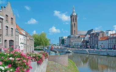 A canal in Roermond lined with flowers, Netherlands